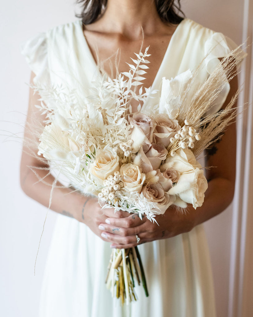 Pure white wedding flowers with dried stems